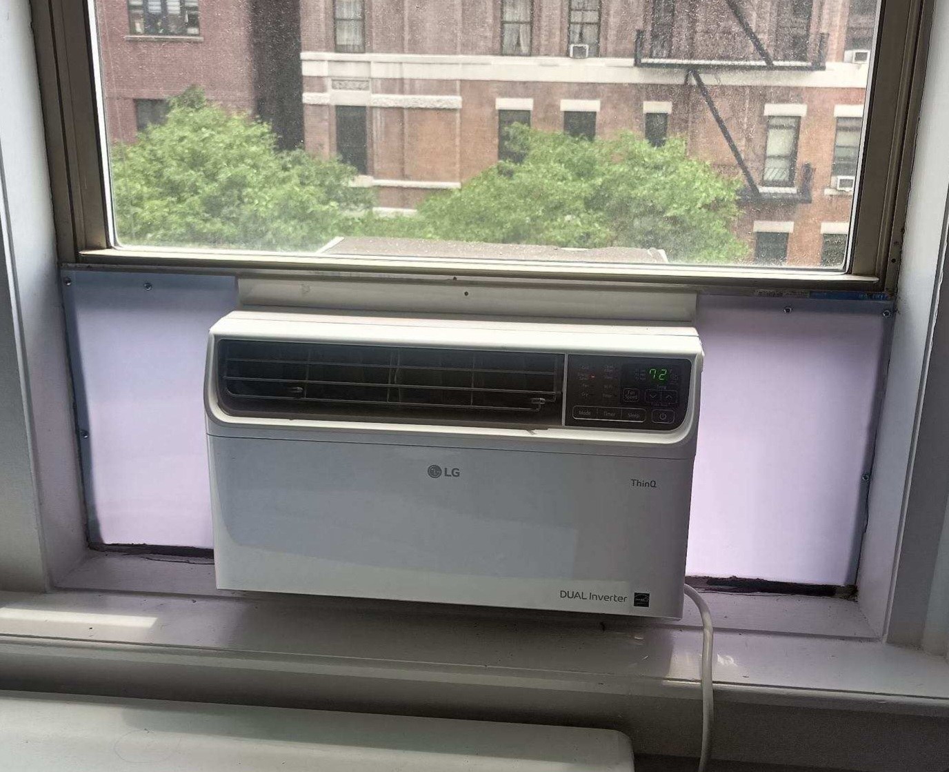 LG window AC installation with white plexiglass panels